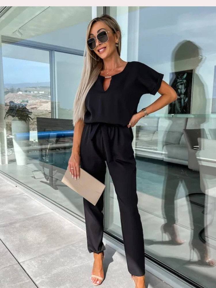 Noor - Stijlvolle slim leg jumpsuit met centuur en korte mouwen - Felesty